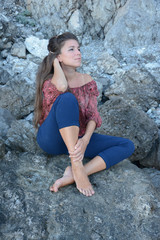 Happy woman relaxing and enjoying at the beach during travel holidays vacation outdoors at ocean or nature sea at sunset time