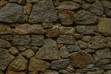 Background. Large stones in the wall.Close-up