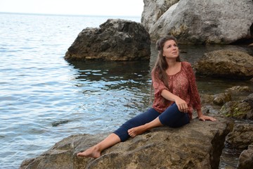 Happy woman relaxing and enjoying at the beach during travel holidays vacation outdoors at ocean or nature sea