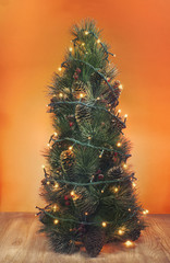 Christmas tree decorated with flashing lights, on a bright background