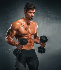 Fototapeta na wymiar Handsome Muscular Men Lifting Weights