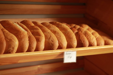 White bread on a display case. Loaf on sale in a display case. Baking, flour products in a bakery