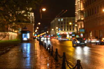 Fototapeta na wymiar View of traffic in city street, night scape, blured bokeh background