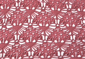 A lace pattern, crocheted sample on a light background, geometrical ornament  