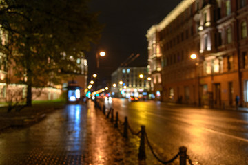 Fototapeta na wymiar View of traffic in city street blurred bokeh background, night scape
