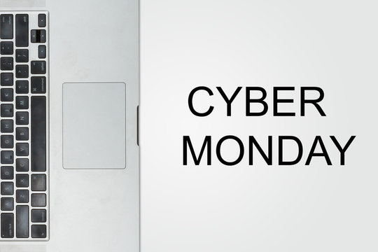 Cyber monday with laptop on gray