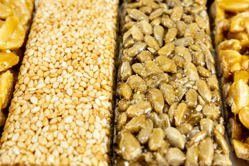 sugar glazed kozinak, sunflower seeds and peanuts in sugar glaze,  oriental sweets close-up macro, brittles