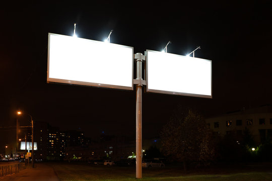 Two Billboards At Night In The City.