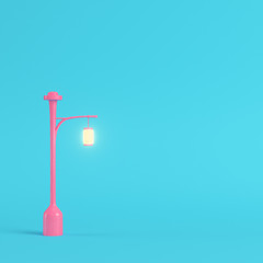 Pink street light on bright blue background in pastel colors