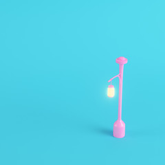 Pink street light on bright blue background in pastel colors