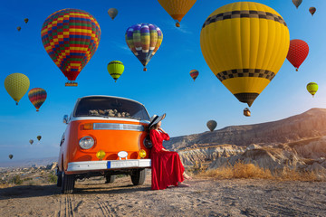 Beautiful girl looking at hot air balloons in Cappadocia, Turkey. © tawatchai1990