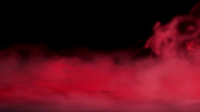 Realistic red dry ice smoke clouds fog overlay for different projects at black background. Slow motion