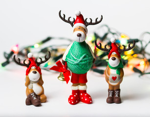 Christmas deers on garland background
