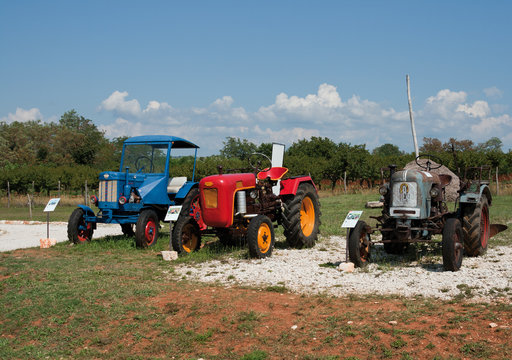 Stihl, Eicher and Hanomag antique tractors on display at The Exhibition Of Old Tractors And Display Of Items About Bread, Oil And Wine in Nova Vas, Croatia.