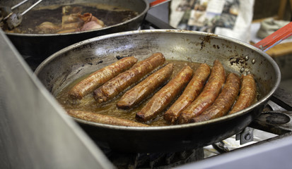 Sausage and bacon frying