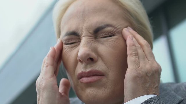 Ill lady boss feeling sudden headache, brain aneurism, neurological disorder