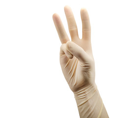 hand in surgical glove shows three palm isolated on white background