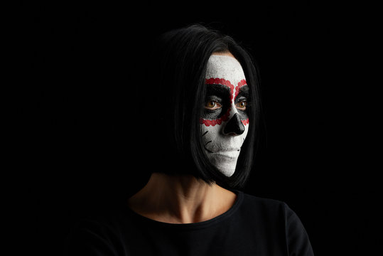 young woman with black short hair in white makeup Sugar head to the day of the dead