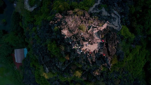 Aerial footage of the famous Dragon Statue and Mua Caves in Ninh Binh, Vietnam during Sunset - Autumn 2019