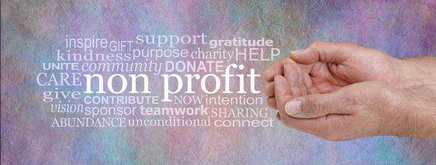 Not for Profit Word Cloud - male cupped hands on right with a NON PROFIT word cloud beside against a rustic multicoloured grunge stone effect background