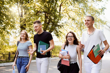 Group of student outdoor in the park after classes