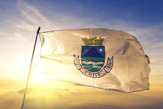 Cotia of Brazil flag waving on the top sunrise mist fog