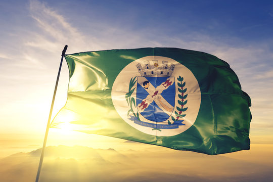 Piracicaba of Brazil flag waving on the top sunrise mist fog