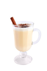 Homemade eggnog with cinnamon isolated on white background. Typical Christmas dessert.