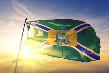 Sinop of Brazil flag waving on the top sunrise mist fog