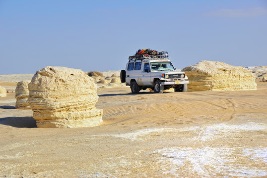 EGYPT, SAHARA - DEC 26, 2008: Off-road car Toyota Land Cruiser  shown in the desert. Extreme desert safari is one of the main local tourist attraction in Egypt