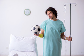 Young man staying in hospital in transfusion concept