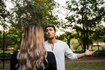 Man argues with his girlfriend for money.