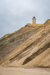 Rubjerg Knude lighthouse in Denmark seen from the beach at the North Sea