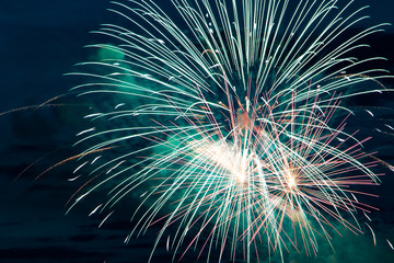 Festive beautiful fireworks in the sky. Celebrating the holiday with a bright salute
