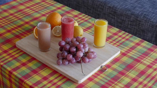 professional 4K View of fruit and juices platter on Caribbean madras style table