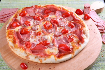 pizza with salami and tomatoes