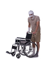 Injured man in wheel-chair isolated on white