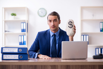 Young male accountant working in the office