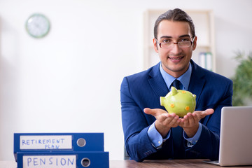 Young male accountant working in the office