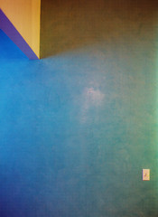 Abstraction of blue wall and triangular piece upper left