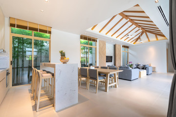 modern interior design in livingroom  of pool villas with high raised ceiling