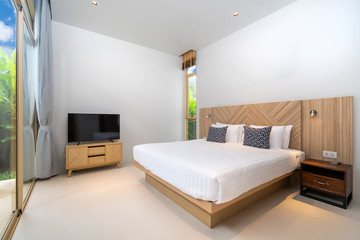Luxury Interior design in bedroom with cozy king bed  in the house