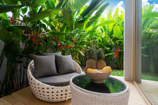 Balcony And Green Garden With Fruit On Table