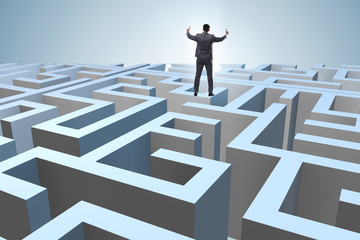 Businessman trying to escape from maze