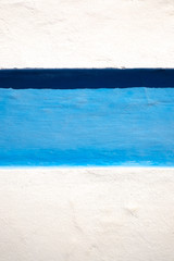 Abstract vivid blue off white and black bands of various width.