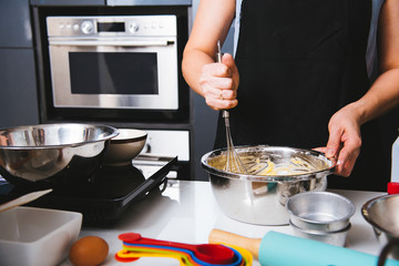Woman beat dough mixer
