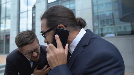 Conscious man calling 911 and supporting partner with stroke symptoms, first aid