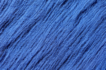 Blue fabric mesh. Rumpled cloth background.