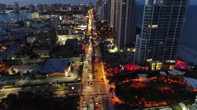 Illuminated cityscape of Collins avenue, Sunny Isles, Miami, United States. Illuminated cityscape of Collins avenue, Sunny Isles, Miami, United States.  Illuminated cityscape of Collins avenue.