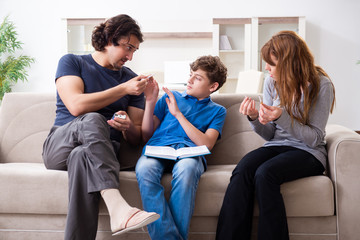 Concept of underage smoking with young boy and family